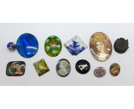 An enamelled silver portrait plaque (acid tested), various other plaques, etc. (12) 