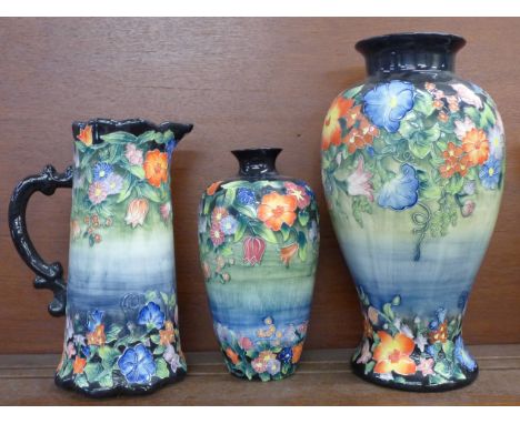 Two Old Tupton ware tube lined vases and a pitcher 