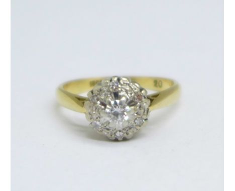 An 18ct gold, platinum set diamond cluster ring, 2.9g, K 