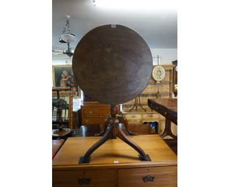 A George III mahogany and ash circular tilt-top tripod table,&nbsp;60cm diameter. 