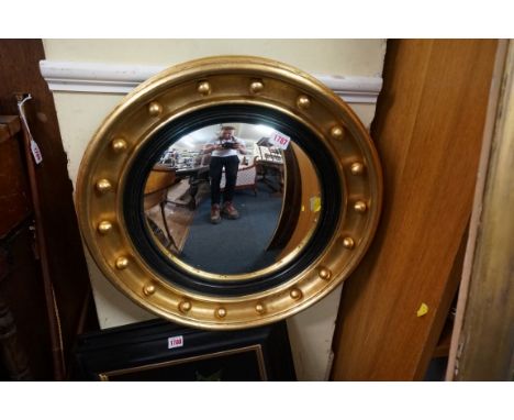 A 19th century giltwood framed convex wall mirror,&nbsp;52.5cm diameter.&nbsp; 