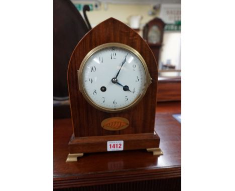 A late 19th century mahogany and inlaid lancet form mantel clock,&nbsp;25cm high, with pendulum. 