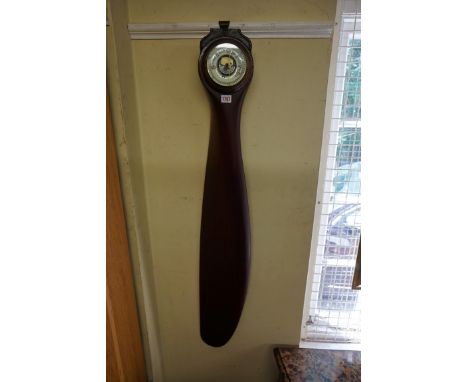 A propeller aneroid barometer,&nbsp;the blade inscribed 'Elora', 130cm long.&nbsp; 