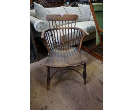 A 19th century yew, elm and fruitwood comb back Windsor armchair.&nbsp; 