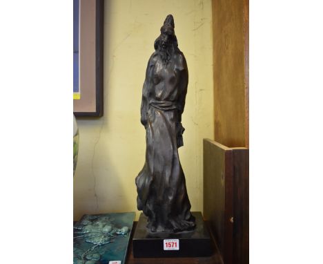 A large bronze oriental figure,&nbsp;indistinctly stamped, on square socle base, total height 51cm. 