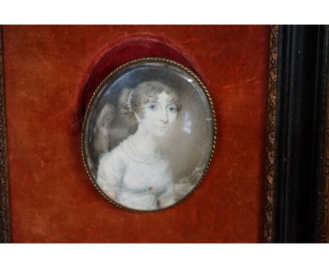 English School,&nbsp;early 19th century, bust length portrait miniature of an elegant lady wearing pearls, probably on ivory,