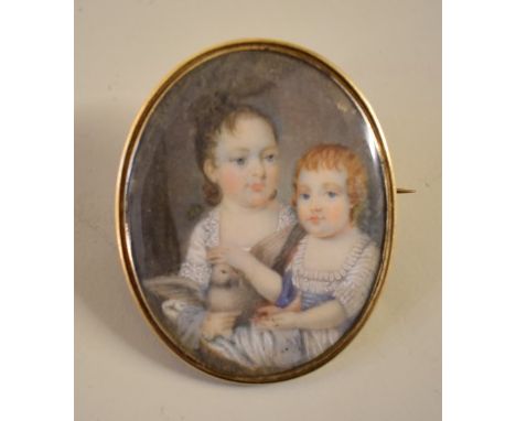 English school, early 19th century, an unusual portrait miniature of two young girls with a dove, probably on ivory, 5.3 x 4.