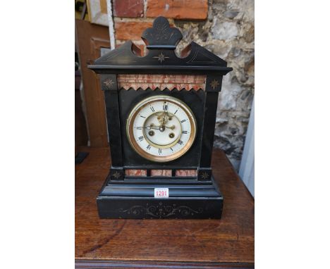 A late 19th century slate and marble mantel clock, with pendulum.&nbsp; 