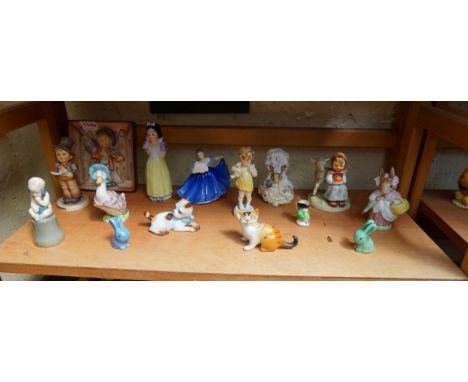 A collection of pottery and porcelain figures,&nbsp;to include: Hummel; Royal Worcester; Royal Doulton; and Beswick, (restora