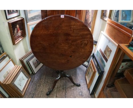 A George III mahogany circular tilt top tripod table,&nbsp;with one piece top and birdcage action, 75.5cm diameter. 