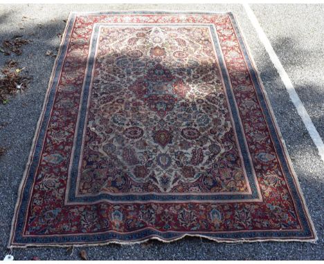 A Persian rug,&nbsp;having floral medallions with allover floral central field, 176 x 125cm.&nbsp; 