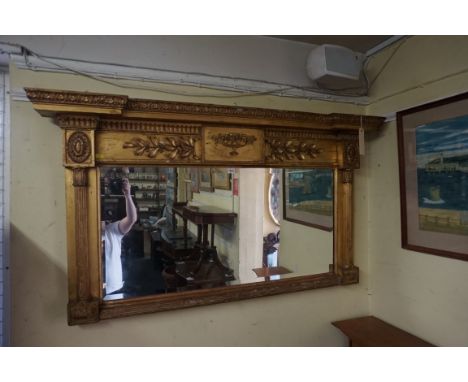 A Regency gilt framed overmantel wall mirror,&nbsp;146.5cm wide.&nbsp; 