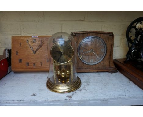 A 1920s/30s oak wall timepiece, by Smiths, 27.5cm wide; together with another similar mantel timepiece, (with associated batt