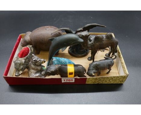 A collection of metal animals,&nbsp;to include a bronze eagle, 15cm wingspan; a silver skinned boar; a bronze camel; bull, et