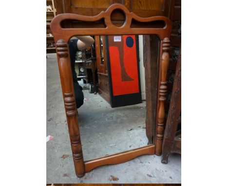 A beechwood framed wall mirror,&nbsp;84 x 56.5cm. 