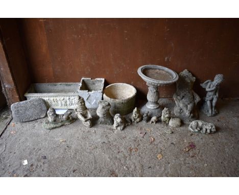 A reconstituted stone planter; together with other garden statuary.&nbsp; 