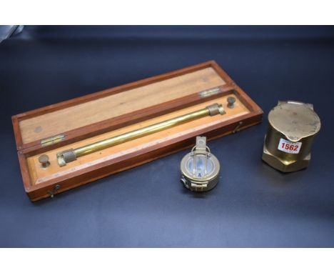 A boxed brass mounted boxwood rolling rule,&nbsp;inscribed 'W H Harling, 47 Finsbury Pavement, London'; together with a brass