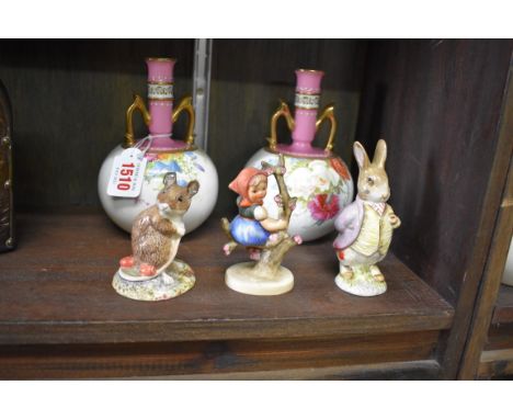 A pair of Mintons twin handled porcelain vases,&nbsp;16cm high; together with a Hummel figure; a Beswick figure; and a Royal 