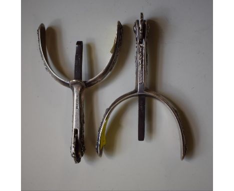 A pair of Maxwell silver plated spurs, with cast decoration, inscribed '9 Dover Street, London'. 