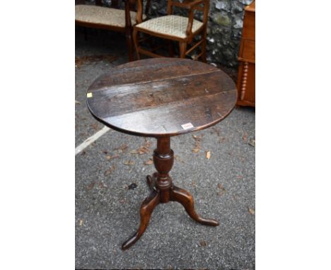 An antique oak tripod table, 53cm wide x 73cm high. 