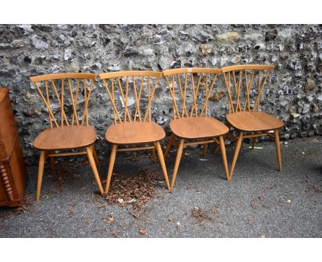 A set of four vintage blonde Ercol candlestick chairs. 