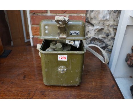 A vintage field sight,&nbsp;in fitted case, with related tripod stand. 