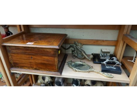 A mixed group of items, to include: a mahogany and inlaid casket, 30cm wide; a slate inkwell; and a brass hand mirror. (5) 