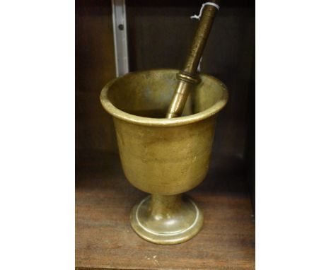 An antique bronze pedestal mortar,&nbsp;17cm high, with similar pestle. 