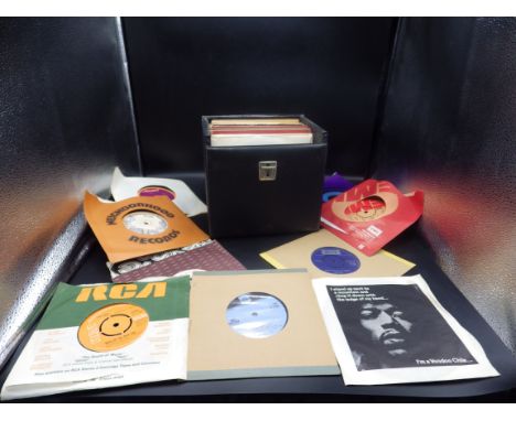 A record case with various 45's - to include Jimi Hendrix, Thin Lizzy, Rod Stewart etc...