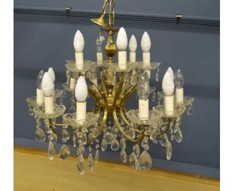 12 Branch gilt brass and cut glass Chandelier. Drop 50cm Diameter 60cm approx&nbsp;