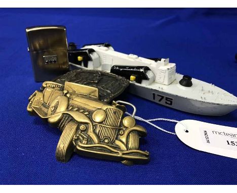 DINKY TOY MISSILE BOAT, also a brass 'Baron Buckle', another, a compact and Zippo lighter