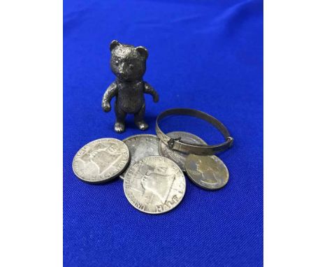 BABY'S SILVER BANGLEand a Sterling Silver reticulated bear and a group of silver coins