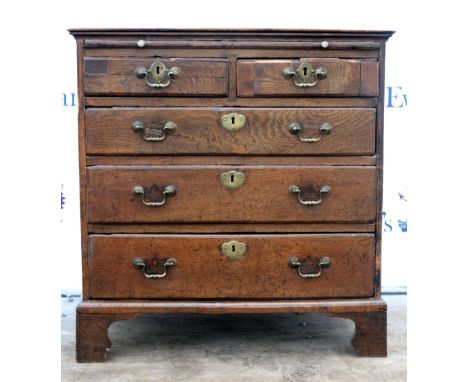 18th/19th century bachelor's oak chest with brushing slide above two short over three long graduated drawers on bracket feet.