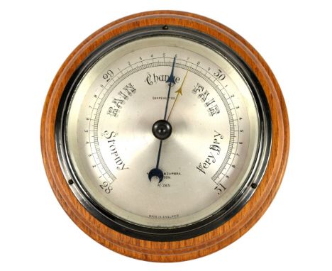 Negretti &amp; Zambra compensated aneroid barometer, the silvered register marked 'Negretti &amp; Zambra, R/2831', 18cm diame