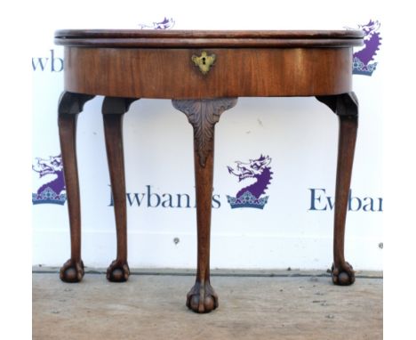 19th century reproduction mahogany demi lune card table with a single drawer raised on cabriole legs and claw and ball feet. 