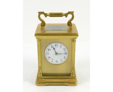 Gilt brass gorge cased carriage clock, the white enamel dial with Arabic numerals and outer minute track, chiming gong, with 