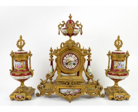 19th century French gilt metal clock garniture, the clock with painted dial with Roman numerals and riverside scene to centre