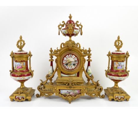 19th century French gilt metal clock garniture, the clock with painted dial with Roman numerals and riverside scene to centre