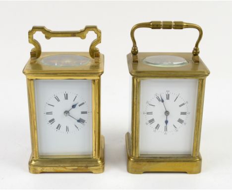 A brass corniche cased carriage clock, the white dial with Roman and Arabic numerals, bevelled glass panels, chiming gong, H1