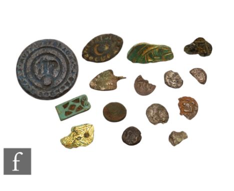 Iron Age, Saxon and Medieval - Five fragmented Dubonni silver units, a partifact chip carved saucer brooch, a similar mount p