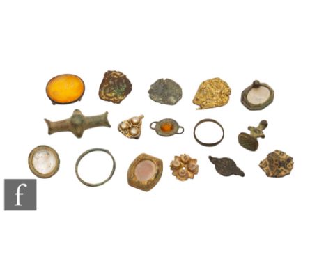 Various - A Tudor gilt dress fastener of triform, a similar mount and four plate mounts possibly Saxon or later, one with gil