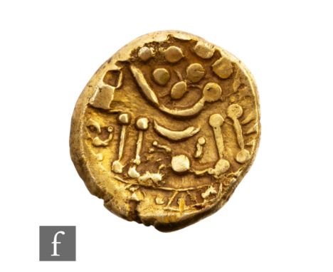 Celtic 85-55 BC - A Durotriges gold stater 'chute' type, abstract head of Apollo, laurel leaves bisected by a line descending