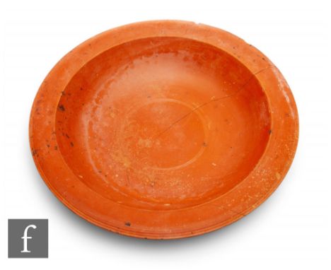 Roman 2nd to 3rd century AD - A large Samian ware ‘terra sigillata’ circular shallow bowl of plain design with a reeded edge 