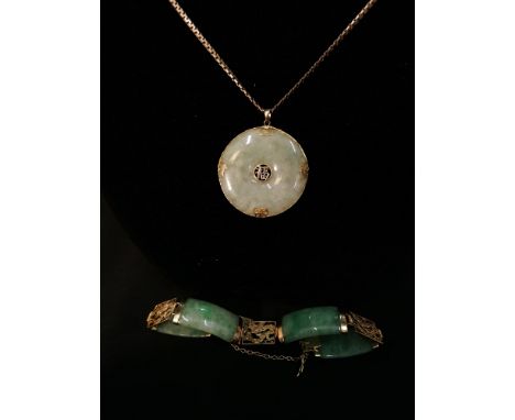 A 14k gold and jade bracelet and pendant with pendant mounted in a 9ct gold 375 chain.