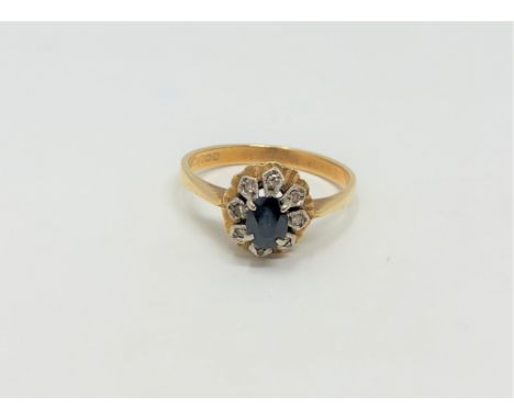 An 18ct gold sapphire and diamond cluster ring, size O CONDITION REPORT: 3.4g