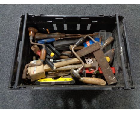 A crate of assorted vintage hand tools 