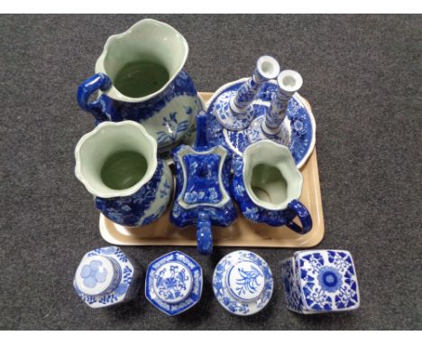 A tray of reproduction Staffordshire and Oriental blue and white china, wash jug, candlestick, caddies etc 