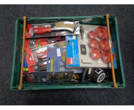 A crate of new tools, wire hand brushes, eight piece down light hole saw, carpenters pencil set, tape measures etc 