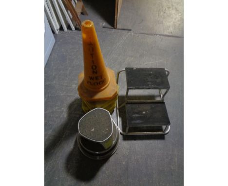 Six wet floor cones, a set of caravan steps and a step stool 