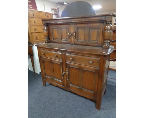 An Ercol elm buffet back sideboard 